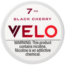 VELO Black Cherry nicotine pouch with warning label on a white background
